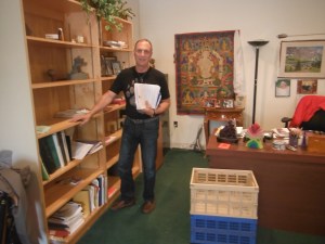 Rick beginning to pack his office up.  These bookshelves used to be completely full and overflowing!